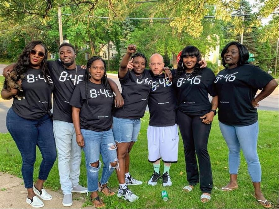UYC participants and community partners gathered at a public event